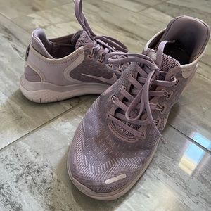 Woman’s lavender Nike Free Run running shoes
